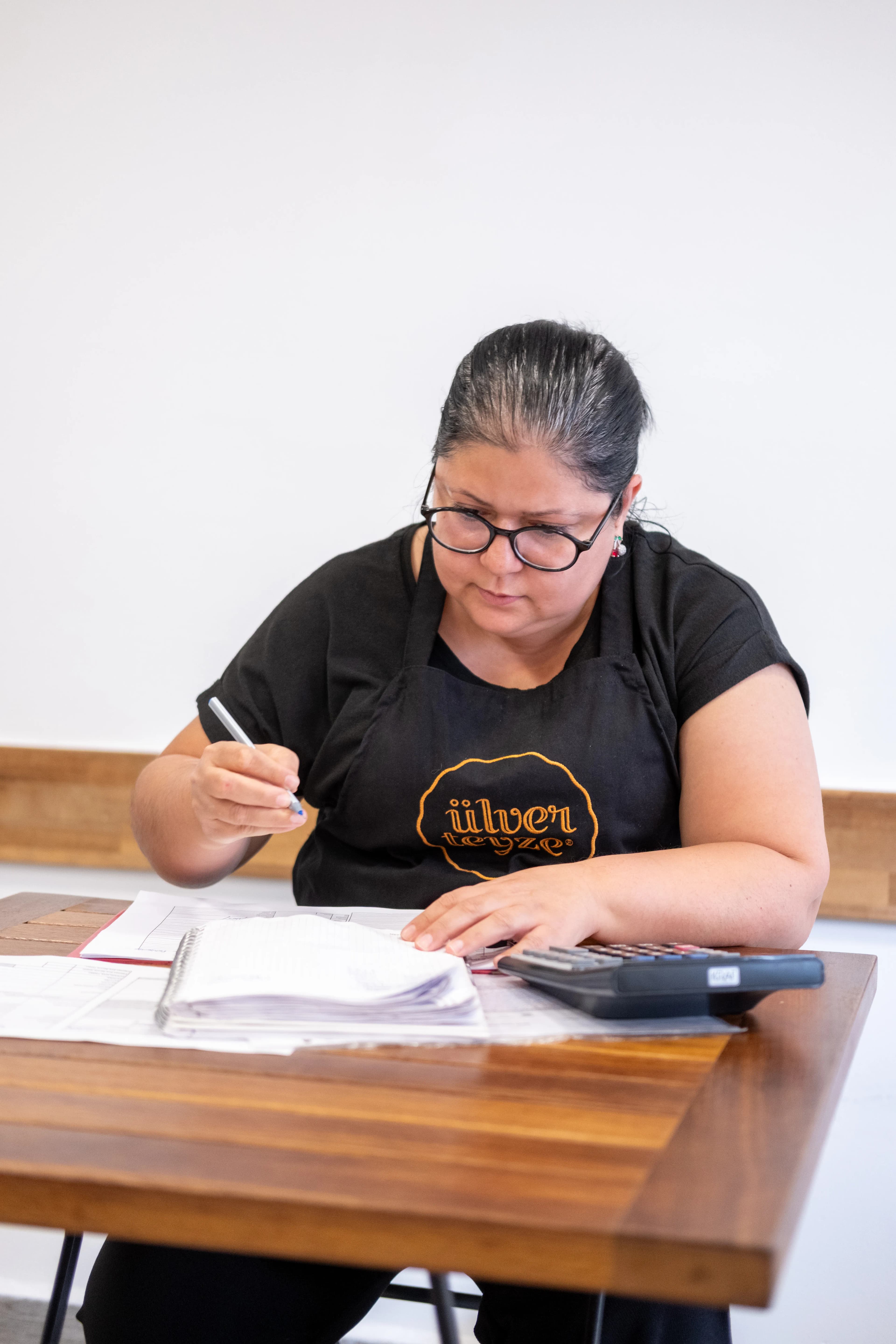 Business owner working through paperwork at a desk