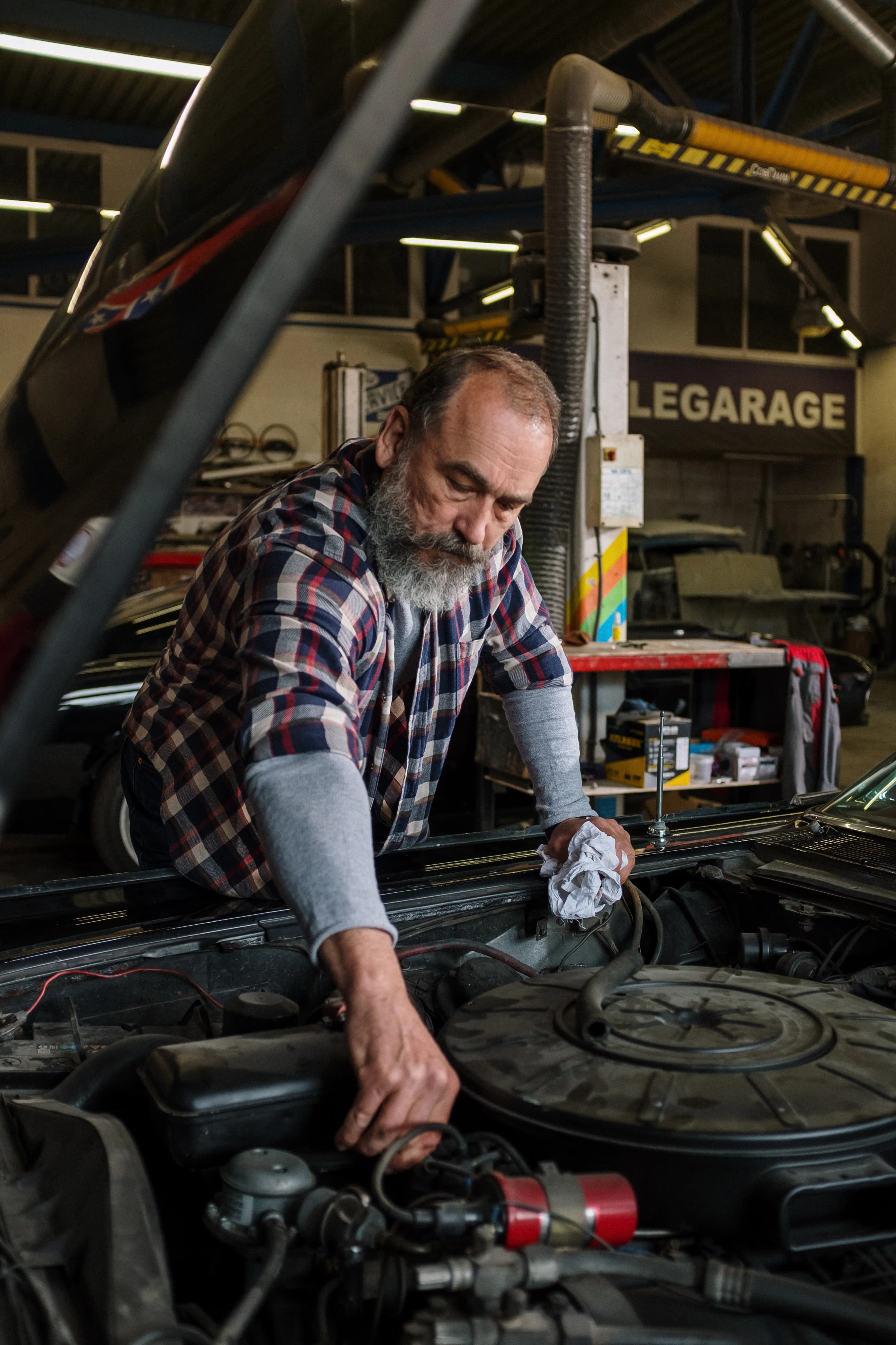 Mechanic working in a car's engine bay