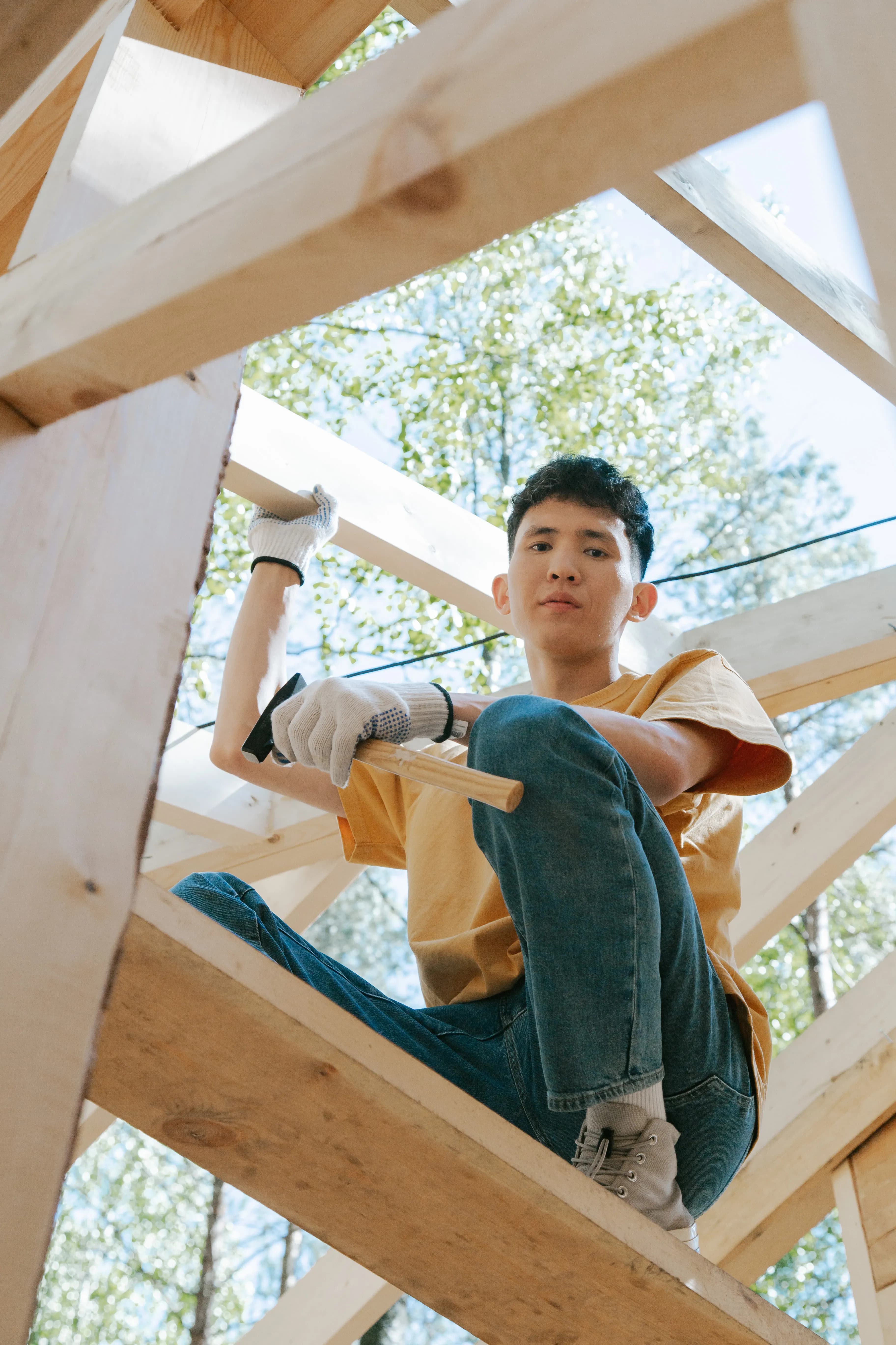 Carpenter working on a wooden roof frame